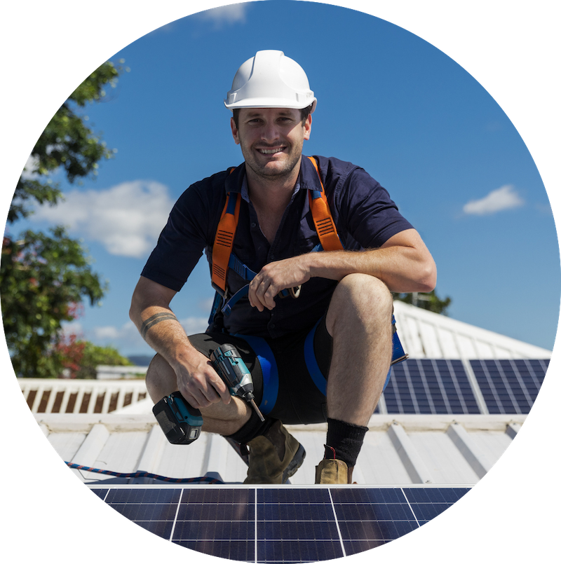 Professional solar installer on rooftop with solar panels